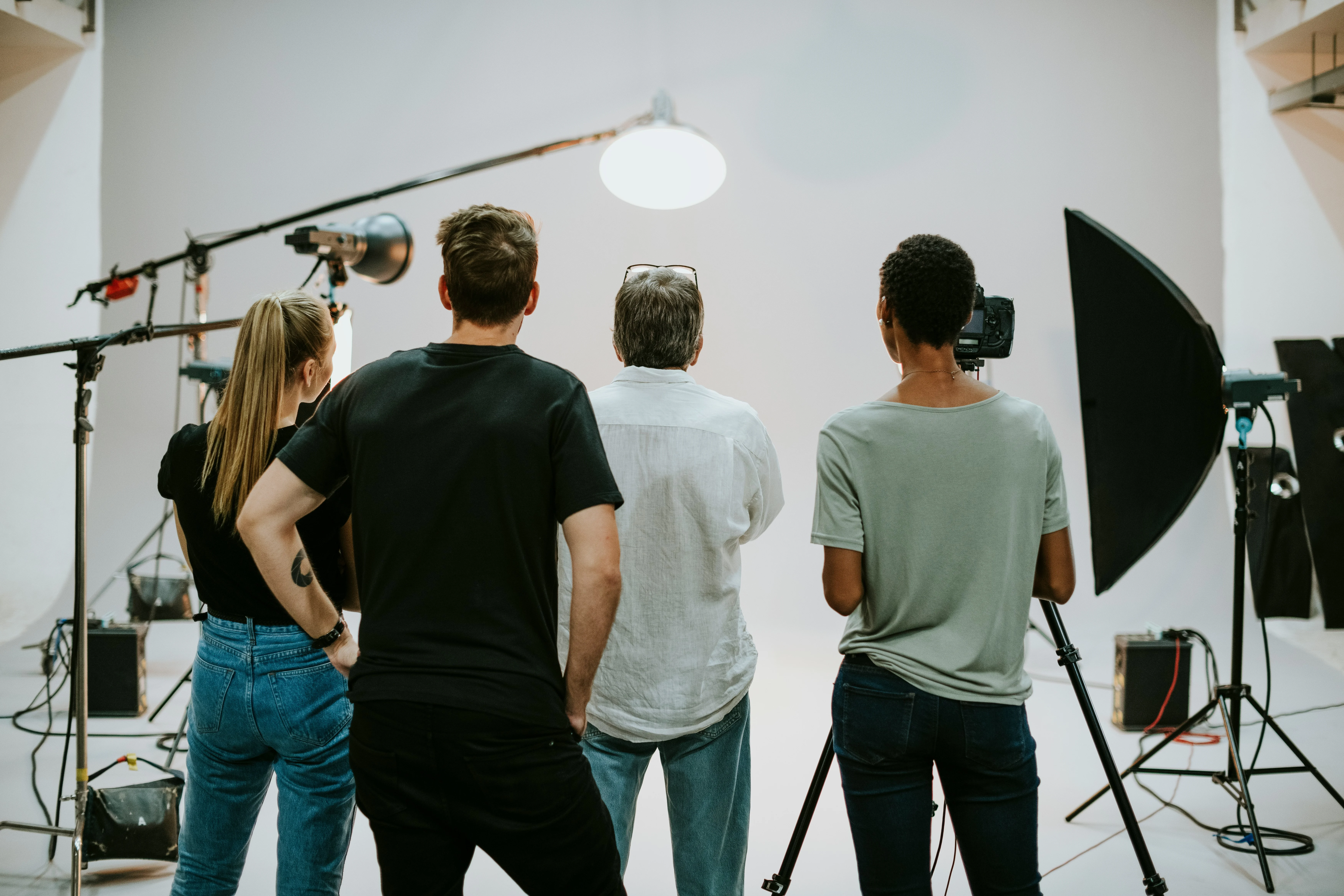 A camera operator filming on location