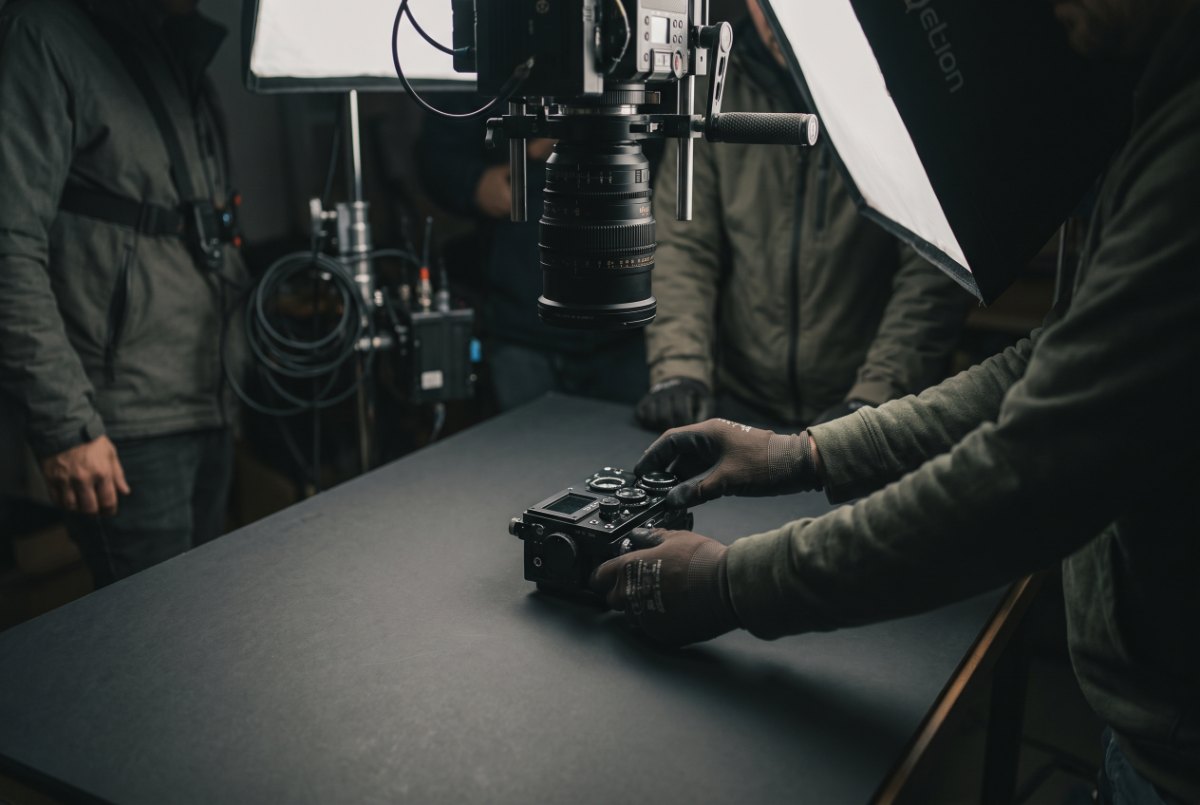An overhead camera rig filming a product demo