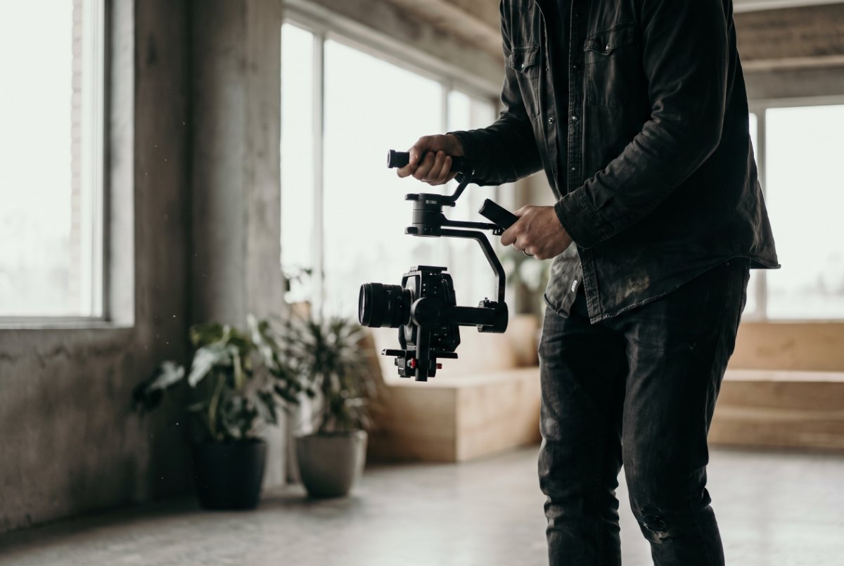 A videographer filming vertical handheld content